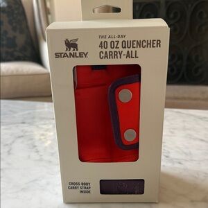 Stanley 40 oz quencher carry all with cross body strap and pockets. New in box